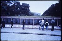 Visitors observing Malvinas Memorial wall