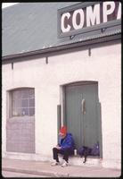 Jack Child sitting in doorway in Port Stanley