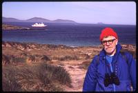 Jack Child on Carcass Island with ship in background