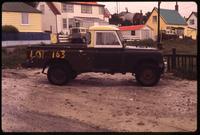 Old pick up truck with "Lot 163" written on its side in Port Stanley
