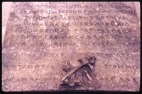 Close up of text on tomb of Bernal Diaz in Antigua, Guatemala