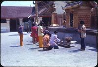 Women praying in front of statues at temple in Doi Suthep