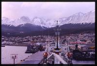 Aerial view of ships and Ushuaia with mountians in background