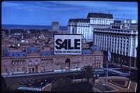 Photograph of For Sale sign above Casa Rosada
