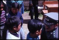View of Gary Prado interacting with local children