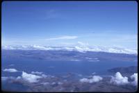 Aerial view of Lake Titicaca with mountians in background