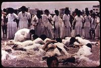 View of religious group wading in water
