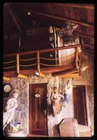 View of second floor balcony and statues on first floor at Casa de Isla Negra
