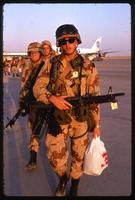 American soldiers walking on an airfield during the Gulf War, Saudi Arabia