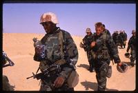 American soldiers walk through the desert during the Gulf War, Saudi Arabia