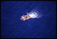 Aerial view of a raft floating in the ocean carrying Cuban exiles, as taken during a Brothers to the Rescue mission, Miami, Florida
