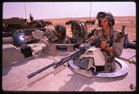 US Army tank personnel operating the machine guns on top of the turret during the Gulf War, Saudi Arabia