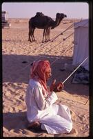 A Sudanese migrant laborer sitting during salat, Saudi Arabia