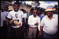 Presidential candidate Father Jean Bertrand Aristide on the campaign trail surrounded by his supporters, Haiti