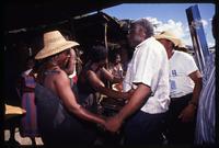 Presidential candidate Marc Bazin shaking hands with a supporter during his campaign, Haiti