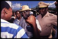 Presidential candidate Marc Bazin greeting supports during his campaign, Haiti