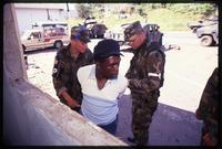 American Military Police taking a Panamanian man prisoner during the United States Invasion of Panama, Arraijan, Panama