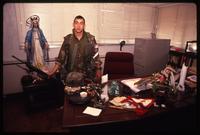 An American soldier with the 82nd Airborne Division stands in the home office of Manuel Noriega during the United States Invasion of Panama, Panama City, Panama