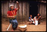 A Kuna women twists string, Darien Gap, Panama
