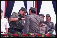 General Humberto Ortega, the Minister of Defense, decorating a soldier, Nicaragua