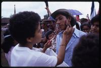 A boy paints the face of a fellow Sandinista supporter at a Daniel Ortega and Sergio Ramirez campaign rally, Matagalpa, Nicaragua