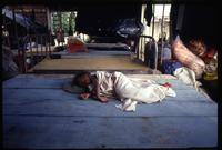 A Miskito child sleeps on a wooden platform in Waspam, Nicaragua
