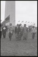 Leaders of a mock funeral procession leave the Washington Monument grounds during a Biafra rally, 12 October 1968