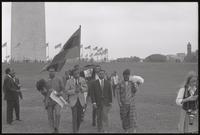 Close-up view of the leaders of a mock funeral procession leaving the Washington Monument grounds during a Biafra rally, 12 October 1968