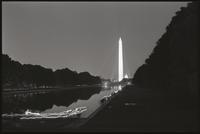 People walking along the south side of the Reflecting Pool towards the Lincoln Memorial while participating in a Biafra candlelight vigil, 25 October 1968