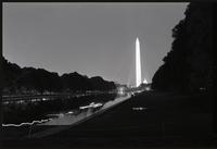 Participants walk along the Reflecting Pool during a Biafra candlelight vigil between the Lincoln Memorial and the Washington Monument, 25 October 1968