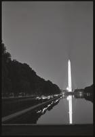 Demonstrators walk around the Reflecting Pool during a Biafra candlelight vigil between the Washington Monument and the Lincoln Memorial, 25 October 1968
