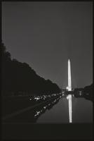 Alternate view of people facing the north side of the Reflecting Pool during a Biafra candlelight vigil between the Washington Monument and the Lincoln Memorial, 25 October 1968
