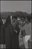 Alternate view of a man conversing with a nun at a Biafra rally at the Lincoln Memorial, 25 October 1968
