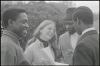 A woman smiles while conversing with attendees at a Biafra rally at the Lincoln Memorial, 25 October 1968