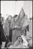 A bearded man holds a Mongolian flag at an anti-war rally at the Sylvan Theater, 26 October 1968