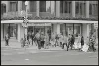 An anti-war march reaches Rizik Brothers on Connecticut Avenue NW, 26 October 1968