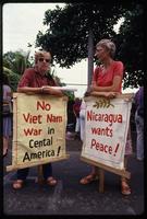 American women hold signs protesting United States aid to the Contras, Nicaragua