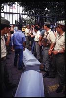 Guards protects the caskets of cargo plane crew members near the American Embassy, Managua, Nicaragua