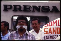 A man, mouth gagged, protests the Sandinista's restriction of the press outside the La Prensa newspaper offices, Managua, Nicaragua