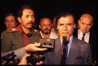 President of Argentina Carlos Menem speaking to the press and standing next to President Daniel Ortega after the Hemispheric Summit Meeting in San José, Costa Rica