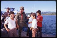 President Daniel Ortega standing with children near a waterfront after the Hemispheric Summit Meeting in San José, Costa Rica