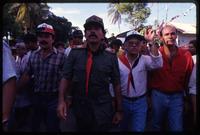 President Daniel Ortega walking down a street with Sandinista supporters after the Hemispheric Summit Meeting in San José, Costa Rica
