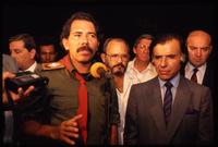President Daniel Ortega giving an interview to the press and standing next to President of Argentina Carlos Menem after the Hemispheric Summit Meeting in San José, Costa Rica