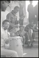 Young men play a cowbell and drums outside a memorial service for Martin Luther King, Jr. at the Washington National Cathedral, 29 March 1969