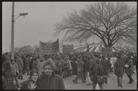 Alternate view of a mass of protesters outside of the counter-inaugural tent on the Mall near Independence Ave SW and 15th St SW, demonstrating against Nixon's inauguration and the Vietnam War, 19 January 1969