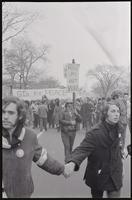 Demonstrators hold hands at the front of a march led by GI's for Peace as they protest against the Nixon inauguration and Vietnam War, 19 January 1969