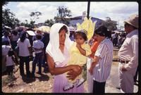 A woman and child posing together while attending a Good Friday procession, Managua, Nicaragua