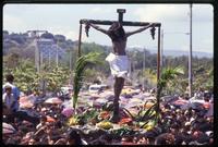 Crowd hoists a crucifix during a Good Friday procession, Managua, Nicaragua