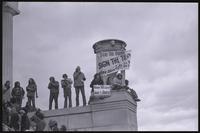 Anti-Nixon protesters in front of the Lincoln Memorial holding signs in reference to ending the Vietnam War ("Stop the bombing, sign the treaty," "Nixon you lied! Sign the Treaty! Nat'l Sign the Treaty Coalition"), 20 January 1973