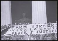 A close-up of a banner promoting the United Farm Workers of America ("Farm Workers, Viva la Causa, Peace & Justice") directly in front of the Lincoln Memorial during protests against Richard Nixon's second inauguration, 20 January 1973